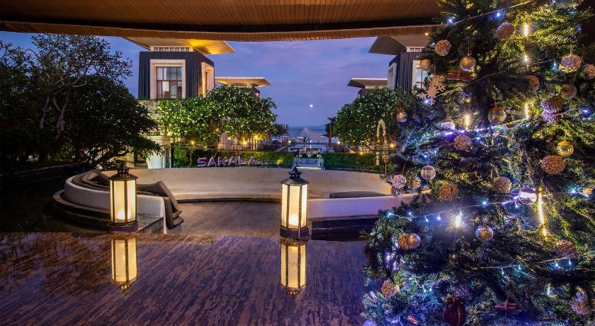 a living room filled with furniture and a christmas tree, The Sakala Resort Bali - All Suites in Bali
