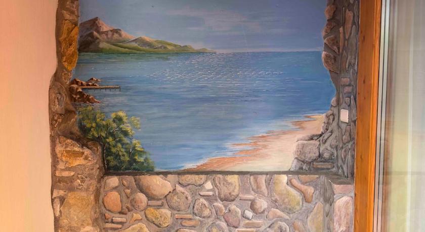 a painting on the wall of a stone wall, Bel Sole B&B in Civitavecchia