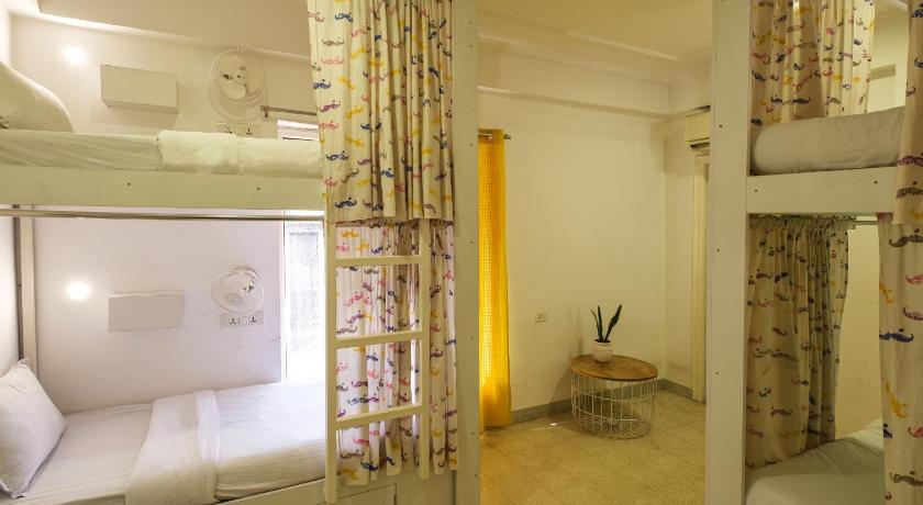 a room with a bed and a window, Moustache Hostel Jaipur in Jaipur