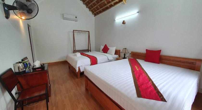 a bedroom with a bed and a dresser, Tam Coc Friendly Homestay in Ninh Bình