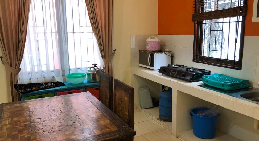 a kitchen with a table and a window, Eton Asia Kota Bunga Villas in Puncak