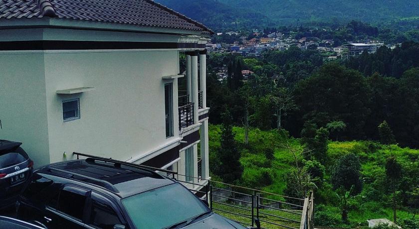 a car is parked in front of a house, Villa HALA in Puncak
