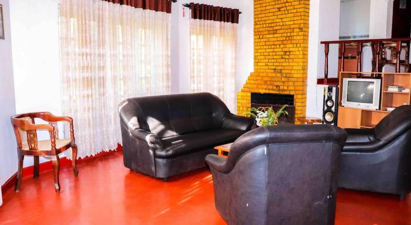 a living room filled with furniture and a tv, Mount Crest Holiday Bungalow in Nuwara Eliya