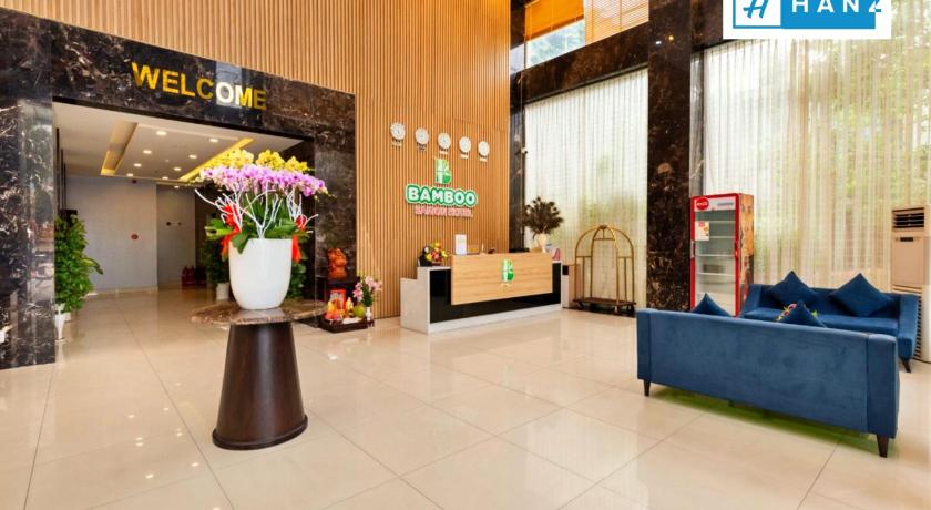 a living room filled with furniture and flowers, HANZ Premium Bamboo Hotel in Ho Chi Minh City
