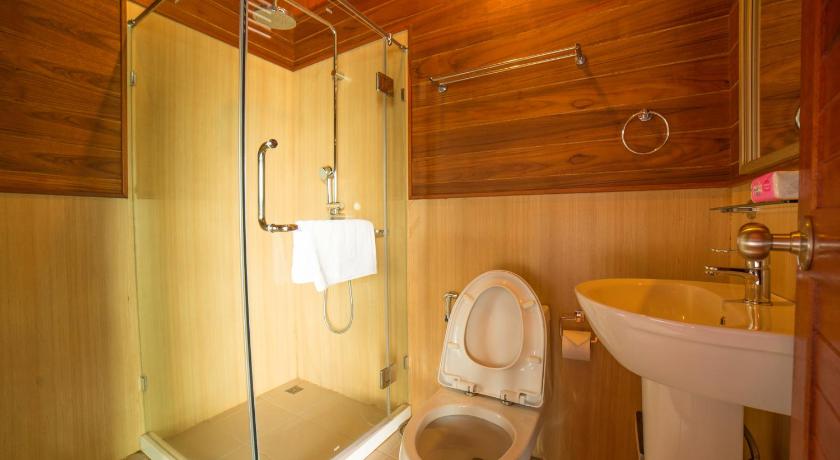 a bathroom with a toilet a sink and a shower, 500 Rai Floating Resort                                                                           in Surat Thani