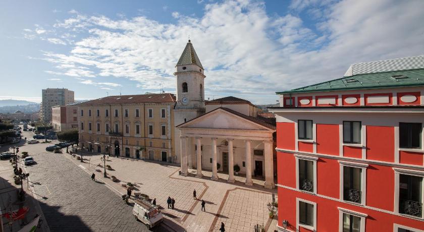 a large building with a clock on the side of it, Ferrari Suite in Campobasso