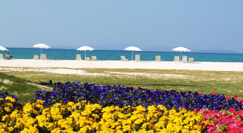 a beach filled with lots of flowers and umbrellas, Okuma Private Beach & Resort in Okinawa Main island