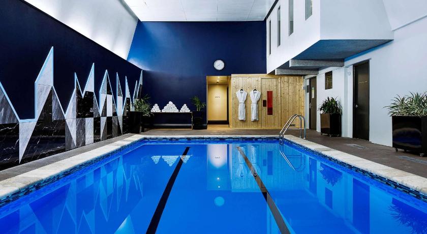 a swimming pool with a blue floor and blue walls, Mövenpick Hotel Wellington in Wellington