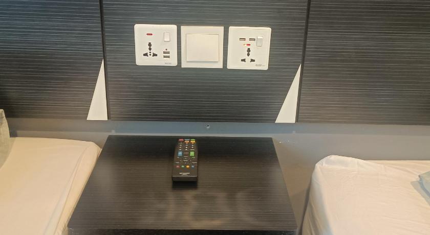 a remote control sitting on top of a counter, Sherwinton Hotel Mentakab Taman Gopeng in Mentakab