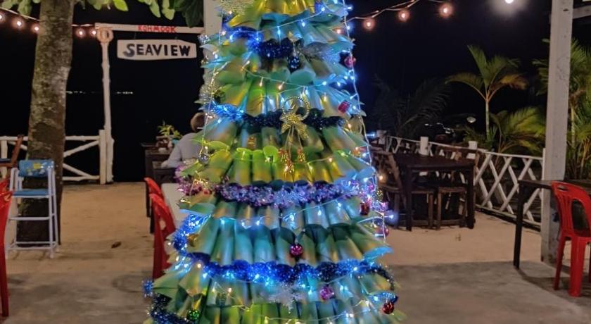 a decorated christmas tree decorated with christmas decorations, Kohmook Seaview bungalow in Trang