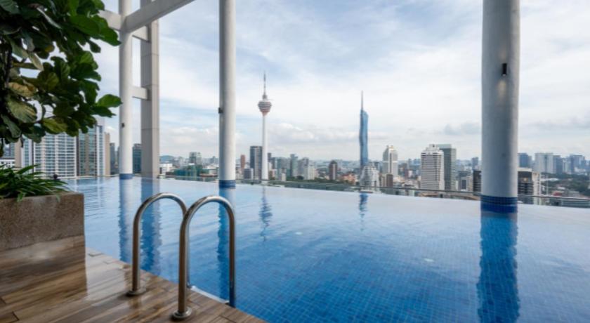 a large body of water with a view of a city skyline, Greystone Colony KLCC in Kuala Lumpur