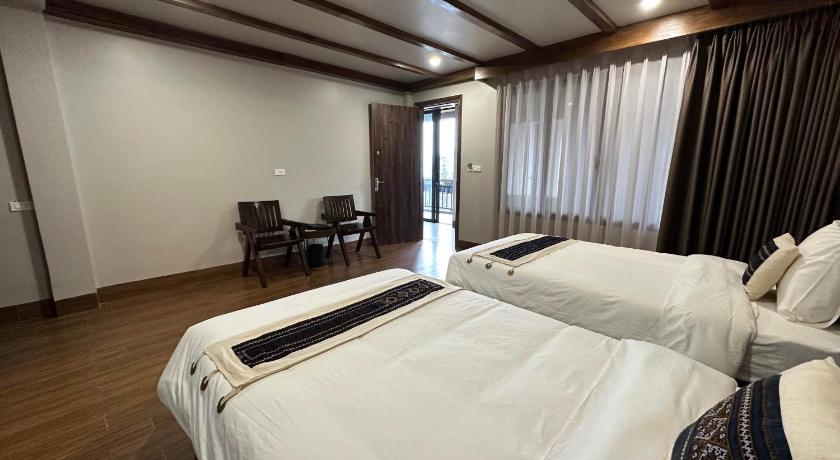 a hotel room with a large bed and a large window, Sapa Pine Hill Ecolodge in Sapa