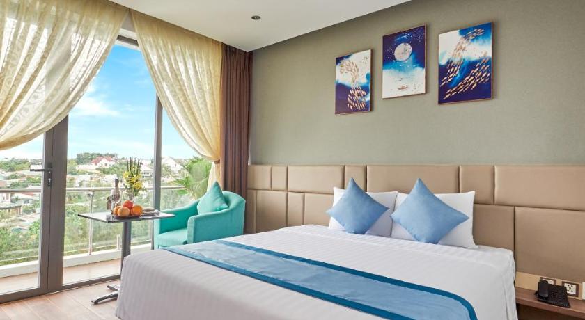 a bedroom with a large bed and a large window, Boston Hotel in Pleiku (Gia Lai)