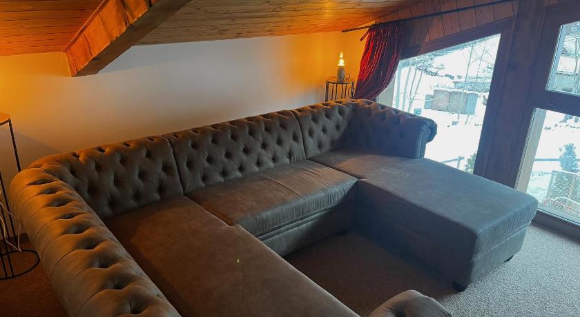 a living room filled with furniture and a fire place, Hotel et Chalet Au Coin Du Feu Chilly Powder in Morzine