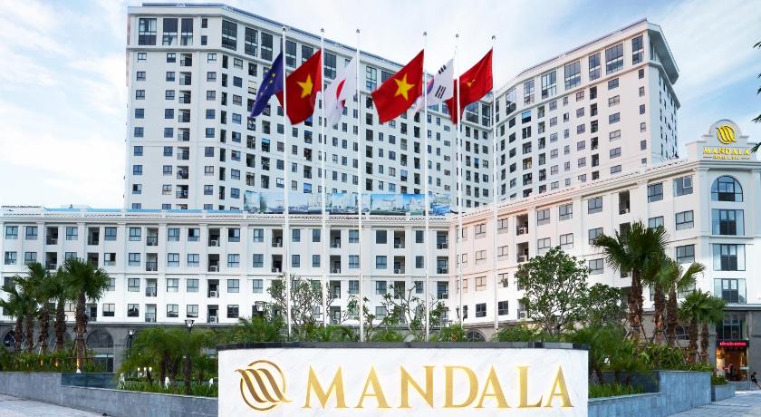a large building with a flag on top of it, Mandala Hotel & Spa Bac Ninh in Bac Ninh