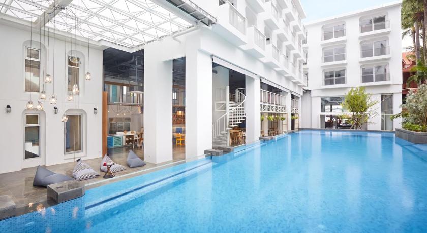 a large swimming pool in a large building, Lub d Phuket Patong in Phuket