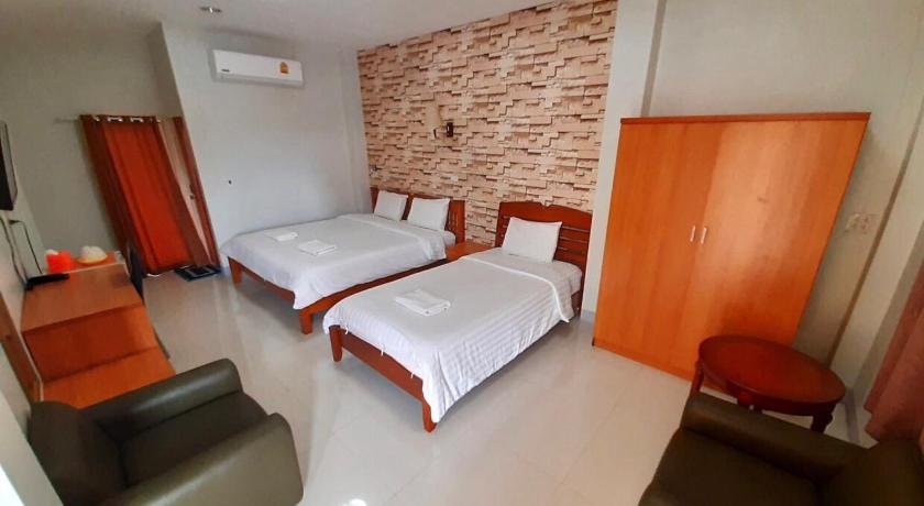 a hotel room with two beds and two lamps, Pantip Residence in Nan