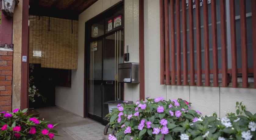 a building with a bunch of flowers in front of it, Lodge Amenouo in Itoigawa