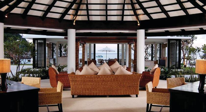a living room with two couches and a table, The Racha (SHA Plus+) in Phuket