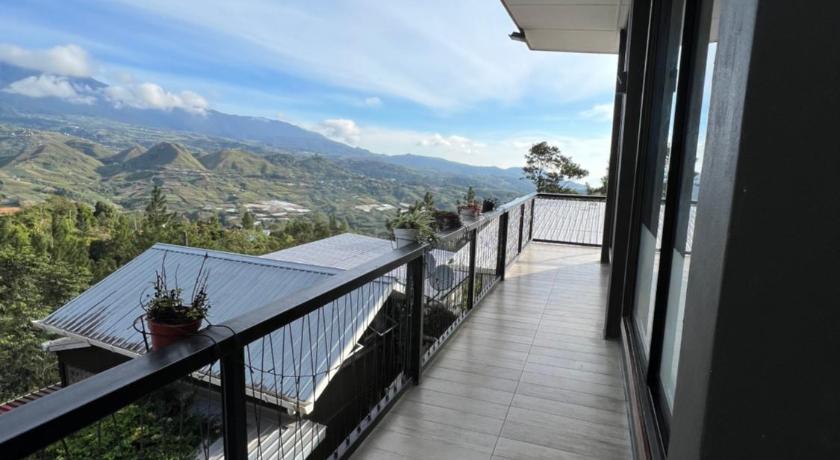 a view from the balcony of a balcony overlooking the ocean, Hidden Hill Homestay Kundasang in Kinabalu National Park