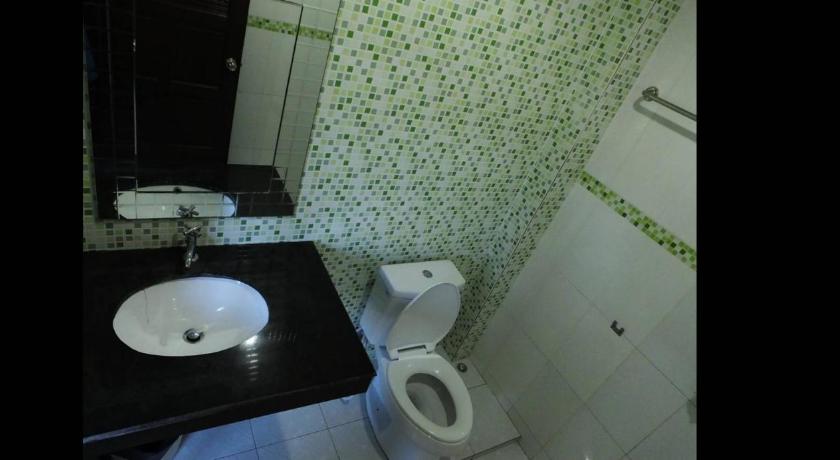 a bathroom with a toilet and a sink, Lanta Nature House (SHA Extra Plus) in Koh Lanta