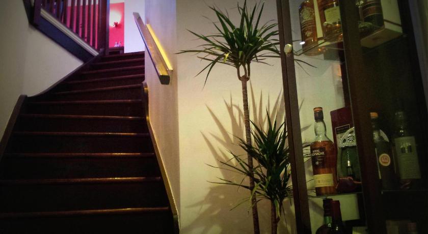 a staircase leading up to a room with a bunch of plants on it, Robin 7 Lodge City Centre in Nottingham