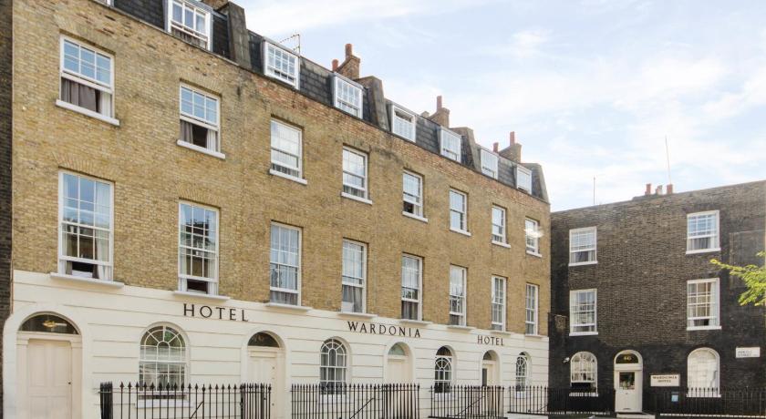 a large brick building with two large windows, Wardonia Hotel in London