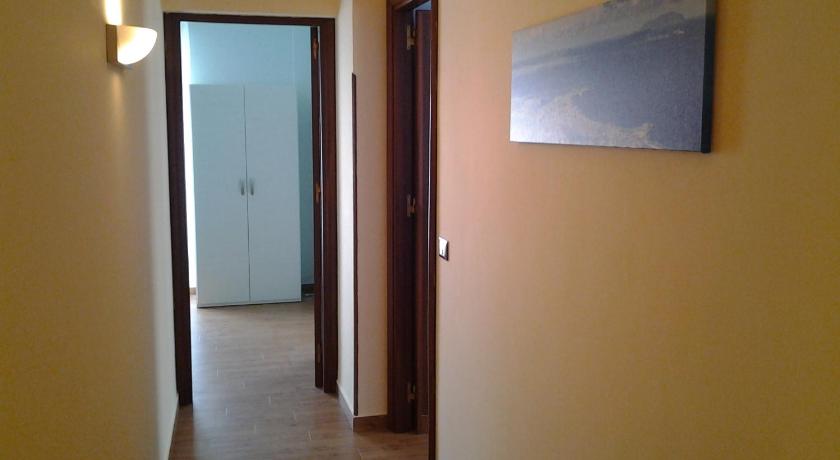 a door is open to a hallway with a picture on the wall, B&B Trapani In in Trapani