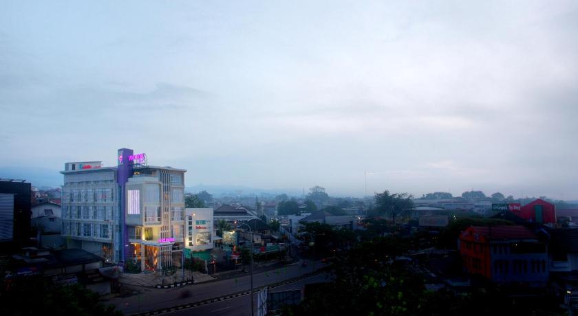 a city street with tall buildings and a sky background, Hotel Vio Pasteur in Bandung