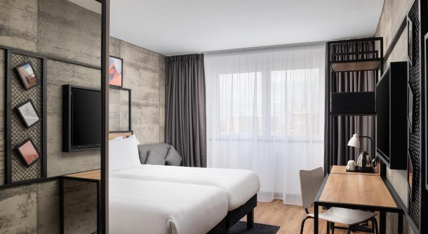 Image of Superior Triple Room with Two Single Beds and One Sofa 1