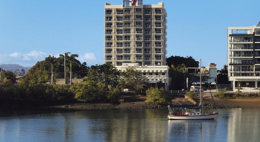 a large boat in the water near a city, Oaks Townsville Metropole Hotel in Townsville