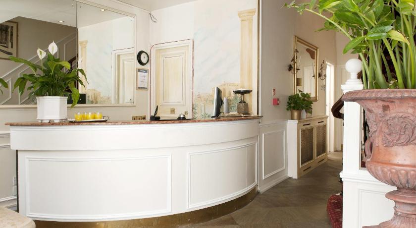 a large white bathroom with a marble counter top, Rushmore Hotel in London