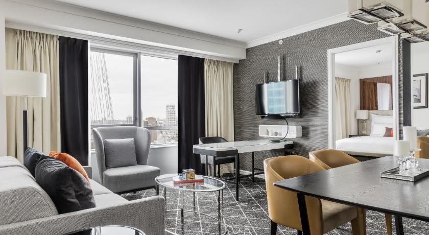 Image of Executive Suite 1 King Bed Separate living room with sofa dining area Club Floor Accessible 3