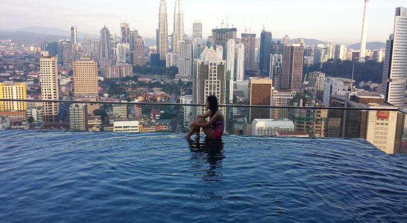 a person on a boat in the water, The Best KLCC View @ Regalia Residences in Kuala Lumpur