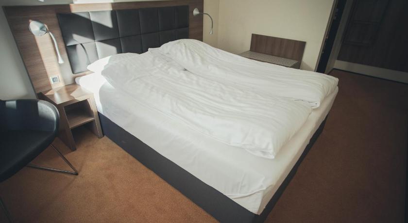 Dvoulůžkový pokoj Premium s manželskou postelí