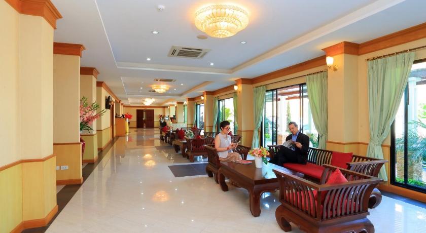 people are sitting at tables in a large room, Royal Nakhara Hotel Nongkhai in Nong Khai