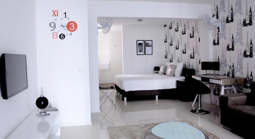 a living room filled with furniture and a large mirror, Prassa 3 Boutique Hotel in Mindelo