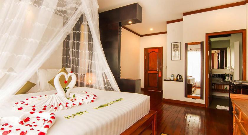 Image of Deluxe Double Room with Balcony and Pool view 0