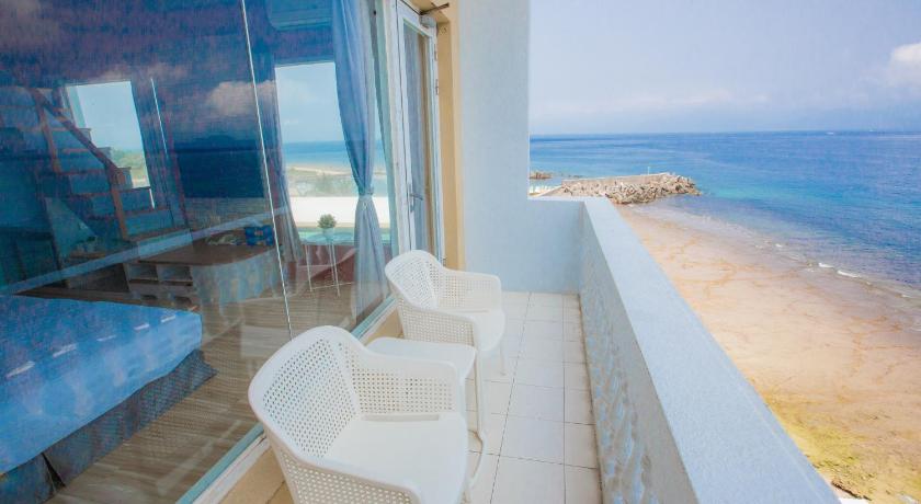 Image of Quadruple Room with Sea View 1