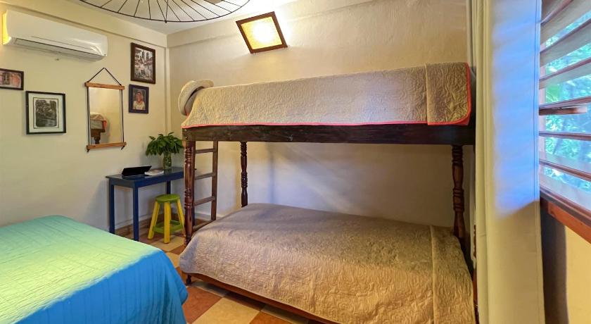 Image of Comfort Quadruple Room with Shared Bathroom 0