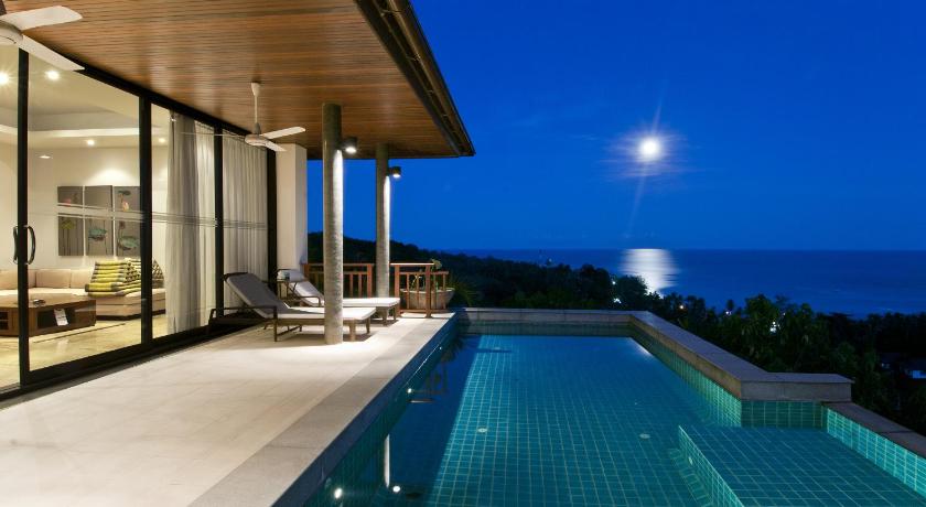 a large swimming pool with a view of the ocean, Baan Saitara Boutique VIllas in Koh Samui