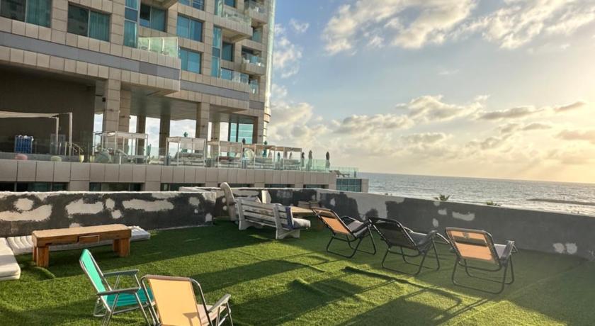 Beach front rooftop apartment photo
