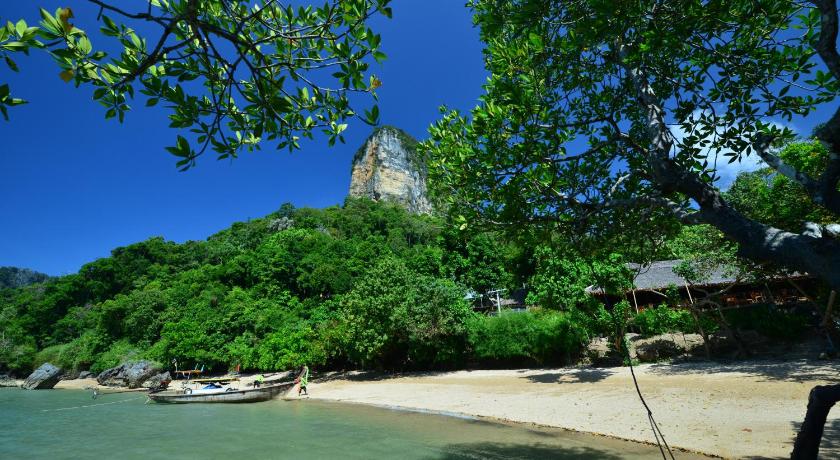 a large stone building with a clock tower on top of it, Railay Great View Resort in Krabi