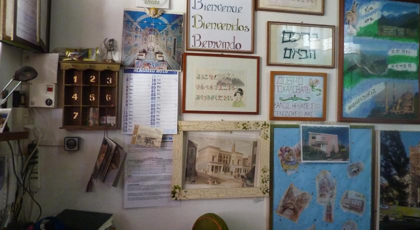 a collage of photos and pictures on a wall, Albergo Junior in Padua