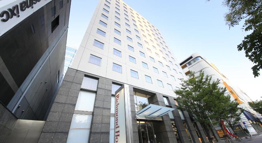 a large building with a clock on the front of it, Richmond Hotel Fukuoka Tenjin in Fukuoka