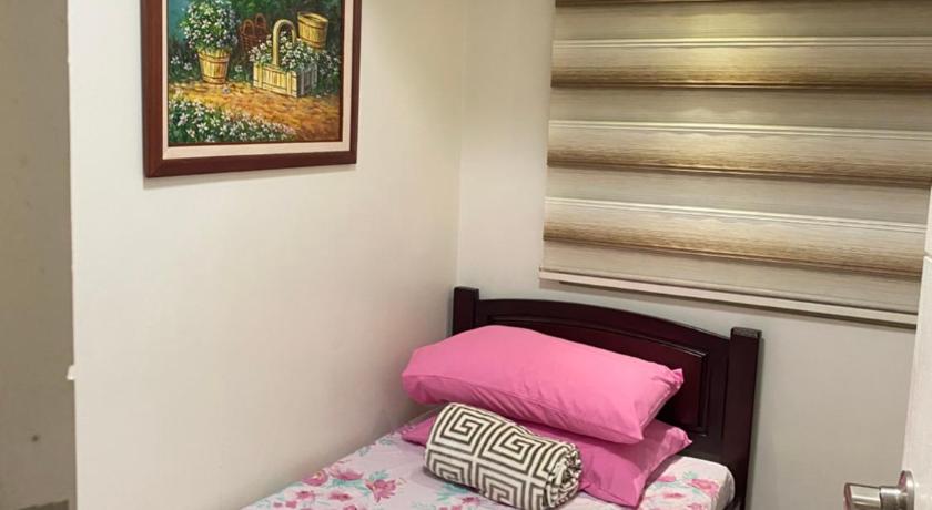 Comfy and Cozy 2BR Condo in BGC with WiFi and Netflix photo