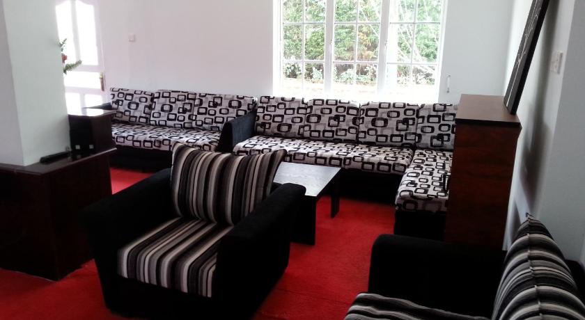 a living room filled with furniture and a couch, La Cottage Boutique Hotel & Restaurant in Nuwara Eliya