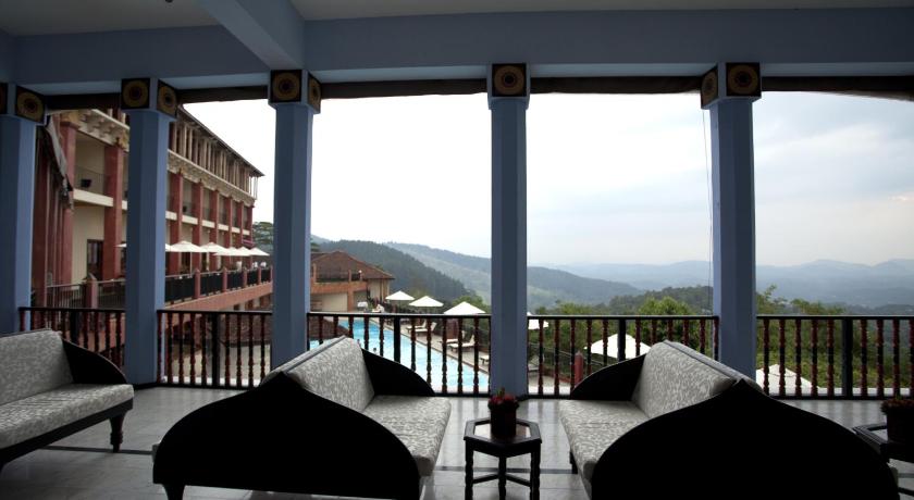 a living room filled with furniture and a balcony, Amaya Hills Kandy in Kandy
