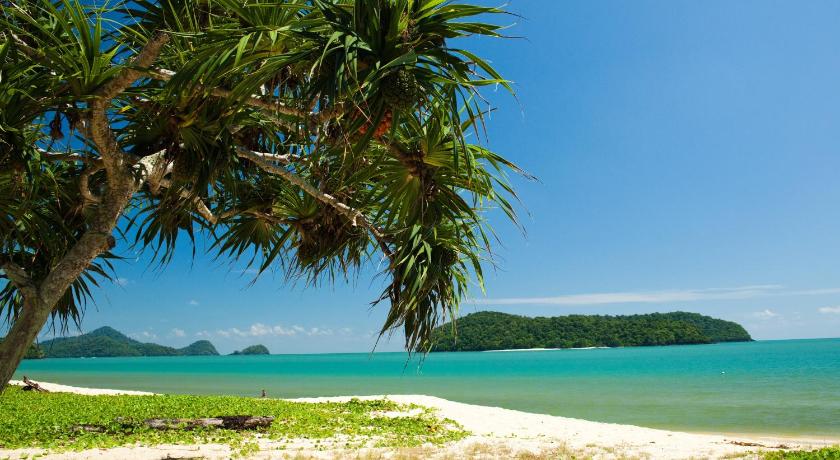 a beach with palm trees and palm trees, Frangipani Langkawi Resort in Langkawi