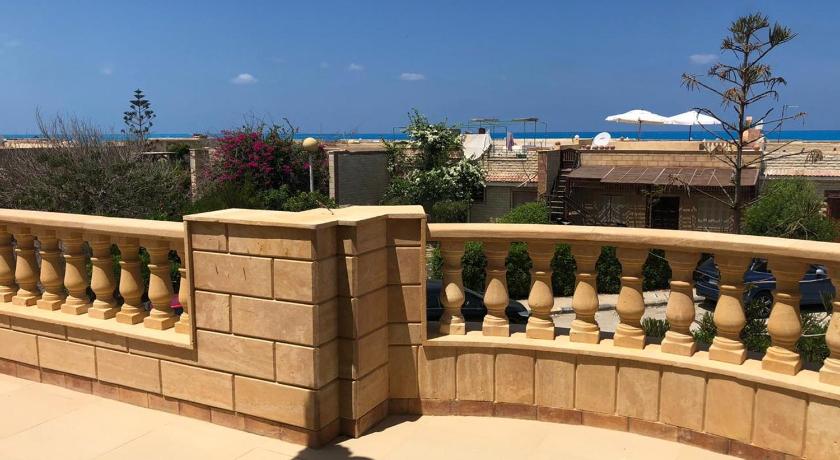 Stunning 5-Bedroom Villa with Breathtaking Sea Views & Roof Penthouse at Badr resort North Coast El  photo